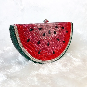 Detail of crystal watermelon clutch featuring hand-set rhinestones and a metal clasp