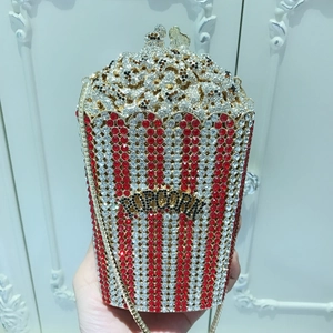 Close-up of luxury popcorn bucket evening bag with red and white crystal stripes
