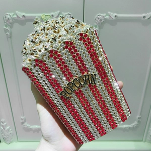 Detailed close-up of popcorn-shaped evening clutch encrusted with vibrant crystals