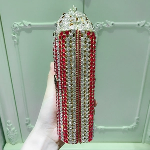 Macro detail of luxury popcorn bucket shaped clutch bag with sparkling inlaid crystals