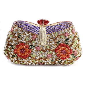 Luxurious evening clutch bag with red rhinestone flowers and blue wing patterns