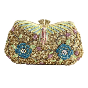 Detailed macro view of colorful floral rhinestone patterns on a luxury evening clutch bag