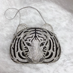 Detailed view of luxury tiger head evening bag with sparkling silver and black rhinestones