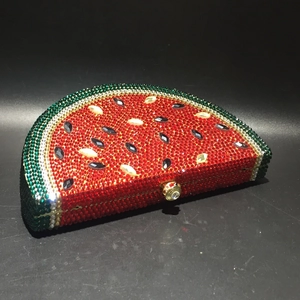 Close-up of a watermelon slice evening clutch bag encrusted with sparkling crystals
