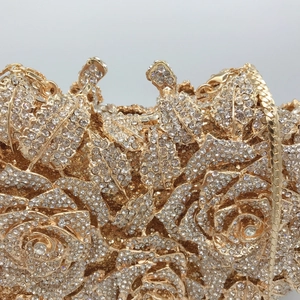 Luxurious gold rose-shaped evening clutch bag with sparkling white crystal rhinestones
