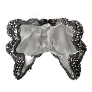 Inside view of butterfly crystal clutch showing silver lining and metal hinge details