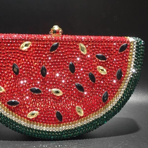 Close-up of watermelon evening bag with shimmering red and green crystal rhinestones