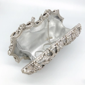 Inside view of silver evening clutch with rhinestones and metal chain strap