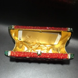 Internal capacity view of watermelon evening bag showing space for a smartphone