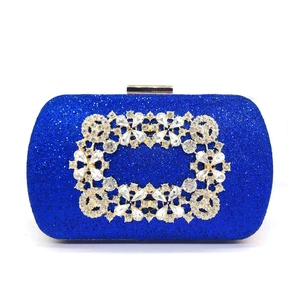 Detail of royal blue sequin evening clutch with crystal buckle and square diamond clasp