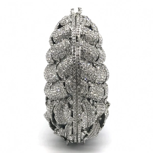 Detailed view of pineapple-shaped silver evening bag featuring full diamond crystal encrusting