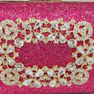 Macro view of sparkly fuchsia sequin evening bag with crystal encrusted square buckle