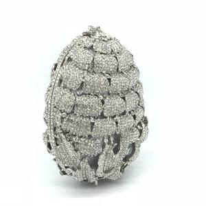 Detailed close-up of sparkling pineapple pattern evening bag with silver rhinestones