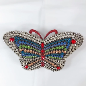 Macro shot of colorful rhinestone butterfly clutch bag with intricate crystal detailing