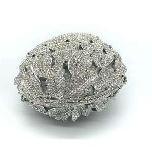 Close-up of sparkling silver crystal pineapple pattern on the luxury metal evening clutch