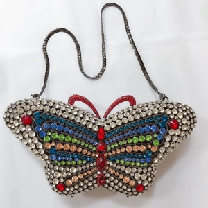 Exquisite butterfly evening clutch featuring vibrant multi-colored rhinestones and chain