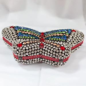 Detailed close-up of butterfly evening bag with colorful crystals and rhinestones
