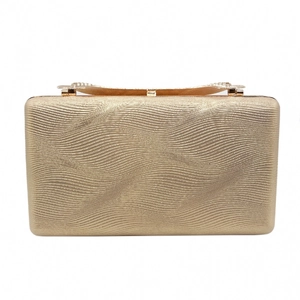 Close-up of champagne gold evening bag showing fine wavy texture and metal clasp