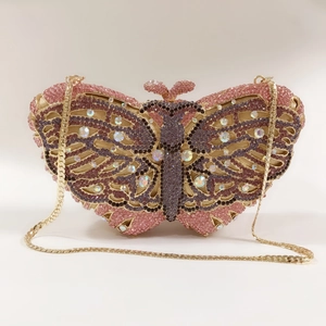 Macro view of gradient pink butterfly evening clutch with sparkling crystal rhinestones