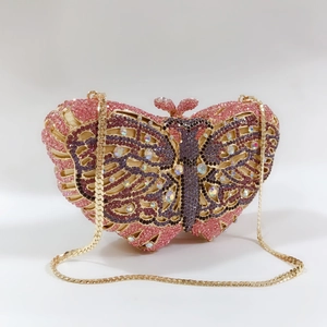Detailed macro view of pink butterfly evening bag with sparkling crystal rhinestones