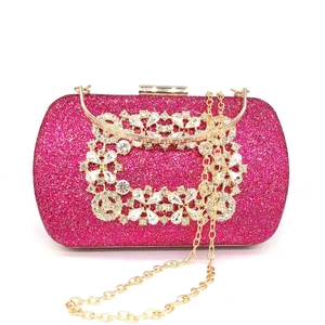 Sparkling fuchsia sequin clutch bag with large flower crystal buckle and gold handle