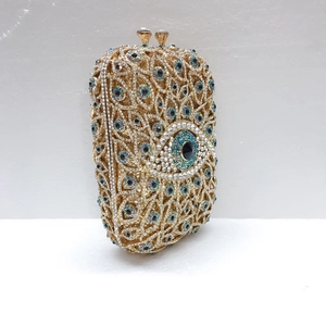 Detailansicht der hohlen Metall-Clutch mit blauem Kristall-Böse-Augen-Muster für Damen