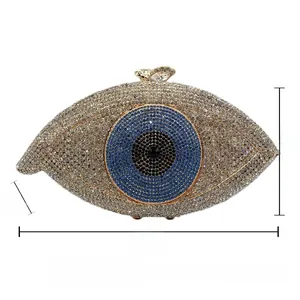 Detail of evil eye evening clutch bag with crystal embellishment and size dimensions