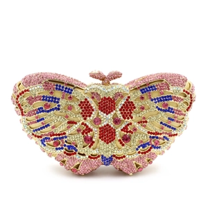 Detailed macro view of colorful crystals on pink butterfly evening clutch bag