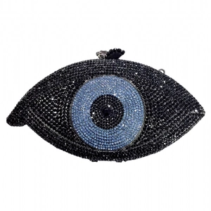 Macro shot of evil eye clutch evening bag featuring sparkling black and blue rhinestones