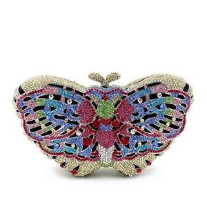 Macro detail of luxury butterfly evening clutch with multi-colored crystals and metal clasp