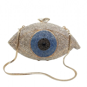Macro shot of evil eye evening clutch with blue crystals and butterfly clasp