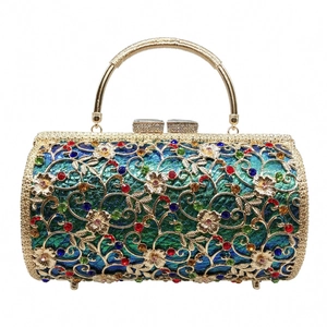Macro detail of luxury floral镂空 metal evening bag with colorful rhinestones and ring handle