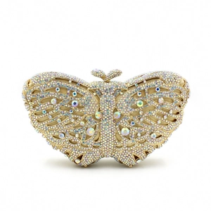 Detailed close-up of butterfly evening clutch with sparkling rhinestones and gold metal frame