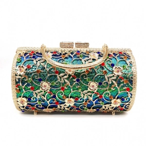 Detailed view of a golden hollow flower clutch bag with colorful rhinestones and crystals