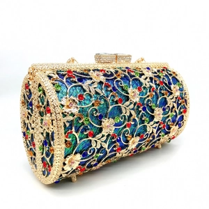 Macro shot of luxury hollow gold metal floral clutch with colorful crystal rhinestones