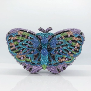 Detailed macro of crystal butterfly clutch with colorful rhinestones and metal butterfly clasp