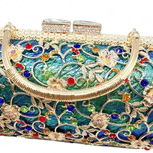Detailed macro of hollow gold metal frame with colorful rhinestones on evening clutch