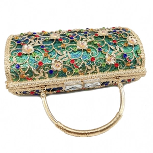Detailed macro view of cylinder clutch with gold hollow flower pattern and crystals