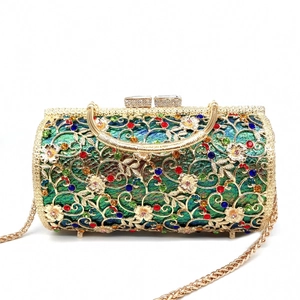 Detail of hollow metal evening bag with colorful rhinestones and floral pattern