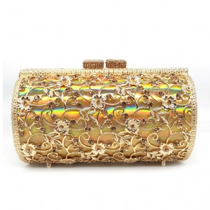 Detailed macro of gold hollow flower pattern on luxury rhinestone evening clutch bag