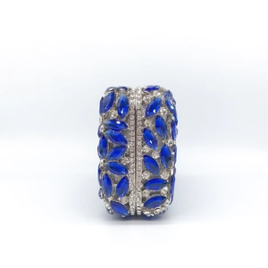 Luxury oval evening clutch with blue rhinestones and silver metal frame for gala events