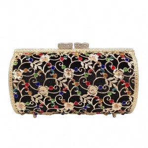 Golden hollow metal evening bag with colorful rhinestones and floral pattern