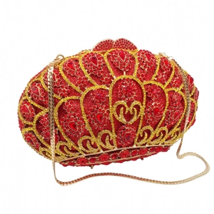 Macro detail of red rhinestone evening clutch bag with ruby petal pattern and gold chain