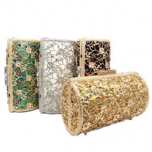Detail of hollow metal evening bags with colorful rhinestones in gold, green, and silver