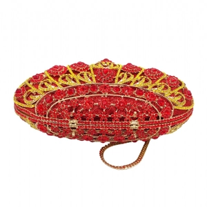 Detail of luxury red diamond evening clutch bag with sparkling crystal floral patterns