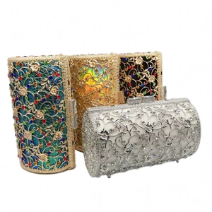 Detail view of four crystal evening bags in emerald, gold, black and silver finishes