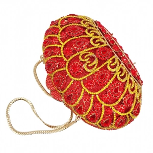Detail of luxury crown clutch with red and gold rhinestones and gold chain strap