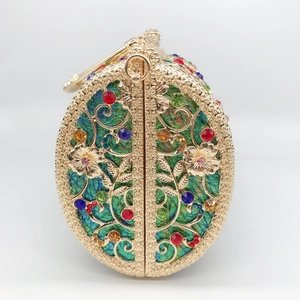 Detailed view of hollow gold metal filigree with vibrant colorful crystal rhinestones