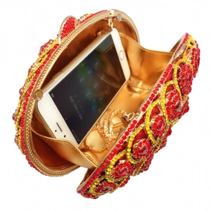 Red and gold luxury evening clutch bag with diamonds showing internal storage space