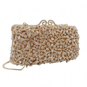 Detailed view of the gold starfish evening clutch with sparkling rhinestone snowflake patterns